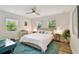 Inviting bedroom featuring a comfortable bed, natural light from windows, and stylish decor, perfect for relaxation at 4324 S Clark Ave, Tampa, FL 33611