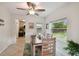 Cozy dining room with backyard views, a ceiling fan and tile flooring at 4324 S Clark Ave, Tampa, FL 33611