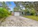A paved driveway leads to this well-maintained home with an attached garage and neat landscaping at 4324 S Clark Ave, Tampa, FL 33611