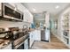 Modern kitchen features stainless steel appliances, granite countertops, and ample lighting at 4324 S Clark Ave, Tampa, FL 33611