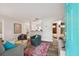 Open living room featuring stylish decor, a colorful rug, and easy access to the kitchen at 4324 S Clark Ave, Tampa, FL 33611