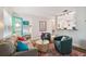 Comfortable living room with modern furniture, a decorative rug, and an open doorway to the bedroom at 4324 S Clark Ave, Tampa, FL 33611