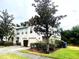 Charming townhome exterior with well-maintained landscaping and attached one car garage at 4617 Ashburn Square Dr, Tampa, FL 33610