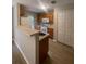 Clean and modern kitchen featuring a refrigerator, countertop, and wood cabinets at 4617 Ashburn Square Dr, Tampa, FL 33610