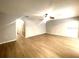 Inviting living room featuring new hardwood floors and a ceiling fan at 4617 Ashburn Square Dr, Tampa, FL 33610