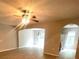 Open-concept living space featuring modern flooring and ceiling fan at 4617 Ashburn Square Dr, Tampa, FL 33610