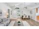 Bright dining area featuring modern lighting and stylish decor in an open floor plan at 4921 Wessex Way, Land O Lakes, FL 34639