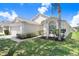 This well-maintained one-story home boasts lush landscaping and a serene curb appeal at 4921 Wessex Way, Land O Lakes, FL 34638