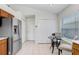 Eat-in kitchen area with stainless steel refrigerator and lots of natural light at 4921 Wessex Way, Land O Lakes, FL 34639