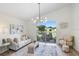 Living room with view of patio, outdoor seating area and pond at 4921 Wessex Way, Land O Lakes, FL 34638