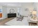 Bright living room boasts high ceilings, wood floors, and stylish furnishings at 4921 Wessex Way, Land O Lakes, FL 34639
