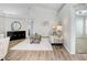 Bright living room boasts high ceilings, wood floors, and stylish furnishings at 4921 Wessex Way, Land O Lakes, FL 34639