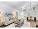 Open floor plan blends living and dining areas under vaulted ceilings, light and airy at 4921 Wessex Way, Land O Lakes, FL 34639