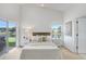 Bright bedroom with views to the pond, white walls, and high ceilings at 4921 Wessex Way, Land O Lakes, FL 34639