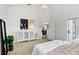 Spacious bedroom with ensuite and view of kitchen at 4921 Wessex Way, Land O Lakes, FL 34639