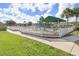 Enclosed community playground featuring multiple play structures and a covered area at 4921 Wessex Way, Land O Lakes, FL 34639