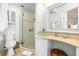 Well-lit bathroom with a glass-enclosed shower, a unique vessel sink, and ample storage space at 501 Janice Pl, Indian Rocks Beach, FL 33785