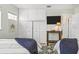 Bedroom with dual beds, minimalist decor, and storage, offering a serene living space at 501 Janice Pl, Indian Rocks Beach, FL 33785