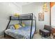 Bedroom with bunk beds featuring colorful decor and overhead lighting at 501 Janice Pl, Indian Rocks Beach, FL 33785