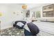 Bright bedroom featuring two beds with striped linens, a patterned rug, and decor, creating a cozy and inviting space at 501 Janice Pl, Indian Rocks Beach, FL 33785