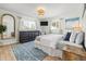 Bright bedroom features wood floors, modern furnishings, and blue accent rug at 501 Janice Pl, Indian Rocks Beach, FL 33785