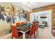Elegant dining area with stylish furnishings, a beachy mural, and an open layout at 501 Janice Pl, Indian Rocks Beach, FL 33785