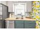 Well-lit kitchen featuring modern appliances, granite countertops, and a bright, cheerful design at 501 Janice Pl, Indian Rocks Beach, FL 33785