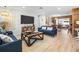 Cozy living room with a large TV, rustic wood accents, and comfortable blue sofas at 501 Janice Pl, Indian Rocks Beach, FL 33785