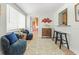 Open-concept living area with stylish furniture, bar seating, and decor creating a cozy and inviting atmosphere at 501 Janice Pl, Indian Rocks Beach, FL 33785