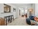 Comfortable living area featuring bar seating, stylish decor, and seamless access to other rooms in the house at 501 Janice Pl, Indian Rocks Beach, FL 33785