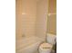Bathroom featuring a tiled tub/shower combination and standard toilet for essential comfort at 5110 Sunridge Palms Dr, Tampa, FL 33617
