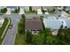 Aerial view of home with well-manicured backyard and brick paved patio at 550 Salmon Ct, Oldsmar, FL 34677
