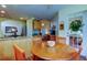Breakfast nook with a table for four, a door to the outside, and a view into the living areas at 550 Salmon Ct, Oldsmar, FL 34677