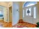 Welcoming foyer featuring a decorative front door with a transom window and side lights at 550 Salmon Ct, Oldsmar, FL 34677