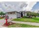 Charming home with a well-kept lawn, mature landscaping, and a two-car garage at 550 Salmon Ct, Oldsmar, FL 34677