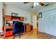 Office area with a full desk, comfortable chair, and bright lighting at 550 Salmon Ct, Oldsmar, FL 34677