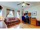 Inviting home office with a cozy sofa, natural light, and a wooden desk setup at 550 Salmon Ct, Oldsmar, FL 34677