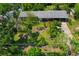 Aerial view of a single-story home featuring a large front yard and carport at 6104 Palm Ave, Gibsonton, FL 33534