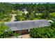 Aerial shot of a home with lush tree coverage offering shade and privacy at 6104 Palm Ave, Gibsonton, FL 33534