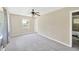 Bright, spacious bedroom with soft carpeting and lots of natural light from one window at 6104 Palm Ave, Gibsonton, FL 33534