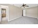 Spacious bedroom features a ceiling fan, neutral colors, and an ensuite bathroom at 6104 Palm Ave, Gibsonton, FL 33534
