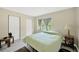 Bedroom with carpet, one window, and a standard closet at 6104 Palm Ave, Gibsonton, FL 33534
