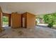 Spacious carport provides covered parking with access to backyard storage at 6104 Palm Ave, Gibsonton, FL 33534