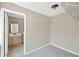 Walk-in closet located adjacent to the primary ensuite bathroom at 6104 Palm Ave, Gibsonton, FL 33534