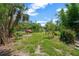 Lush yard featuring mature trees and natural landscaping at 6104 Palm Ave, Gibsonton, FL 33534