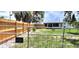The expansive backyard is fully fenced and includes a fire pit at 6825 Hammock Rd, Port Richey, FL 34668