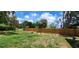 Large backyard with a new wood fence providing privacy for outdoor activities and relaxation at 6825 Hammock Rd, Port Richey, FL 34668