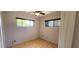 Bedroom with laminate flooring and natural light at 6825 Hammock Rd, Port Richey, FL 34668