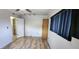 Bedroom with a closet, laminate floors and a ceiling fan at 6825 Hammock Rd, Port Richey, FL 34668
