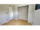 Bedroom with laminate flooring, a large closet, and ample natural light at 6825 Hammock Rd, Port Richey, FL 34668